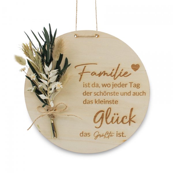 Holzscheibe Zuhause mit weißen Trockenblumen